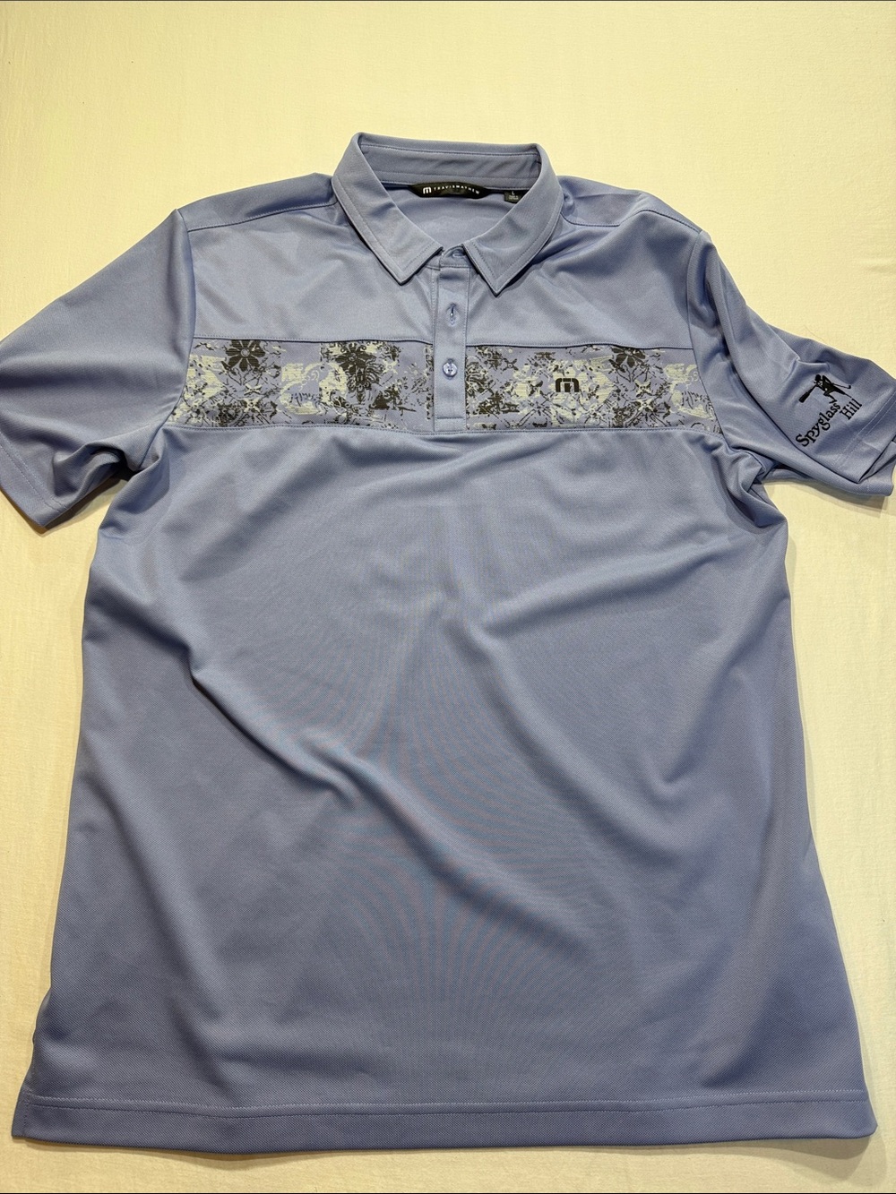 Travis Mathew Lavender Men's golf polo Floral Chest Band - Spyglass Hill logo
